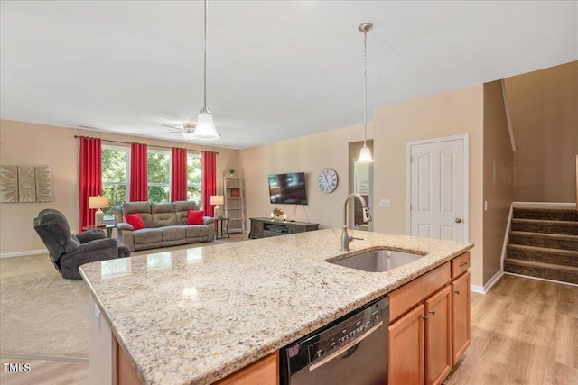 6512 Blalock Forest Dr, Willow Springs, NC 27592 - kitchen with a sink, dishwasher, light stone countertops, open floor plan, and decorative light fixtures