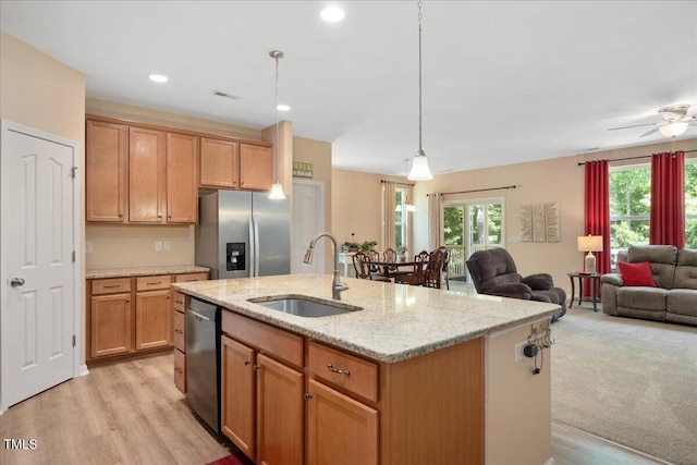 6512 Blalock Forest Dr, Willow Springs, NC 27592 - kitchen featuring a sink, stainless steel fridge with ice dispenser, dishwasher, open floor plan, and recessed lighting