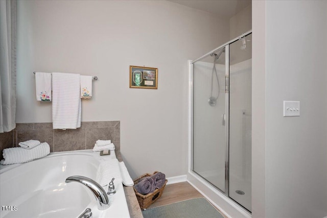 6512 Blalock Forest Dr, Willow Springs, NC 27592 - bathroom with a shower stall, a garden tub, and wood finished floors