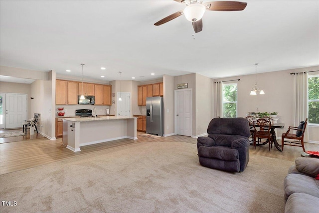 6512 Blalock Forest Dr, Willow Springs, NC 27592 - living room with ceiling fan, recessed lighting, light wood finished floors, a chandelier, and light colored carpet