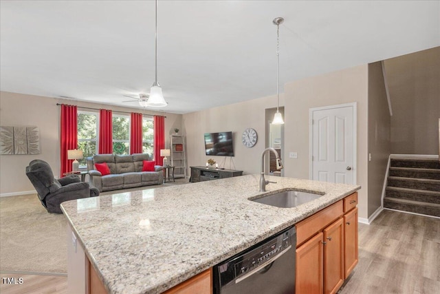 6512 Blalock Forest Dr, Willow Springs, NC 27592 - kitchen featuring black dishwasher, open floor plan, light stone counters, and decorative light fixtures