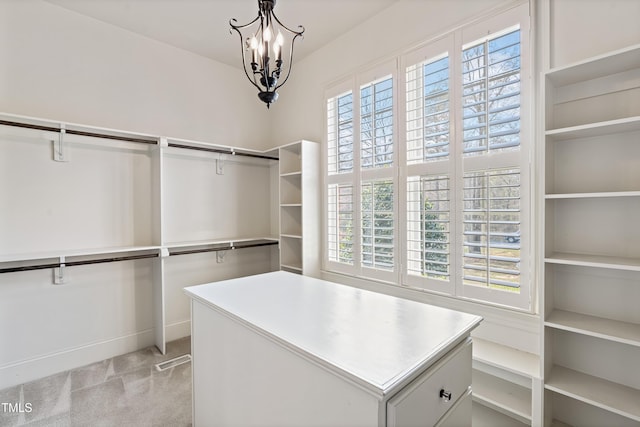 3908 Chaumont Dr, Apex, NC 27539 - walk in closet with a chandelier and light colored carpet