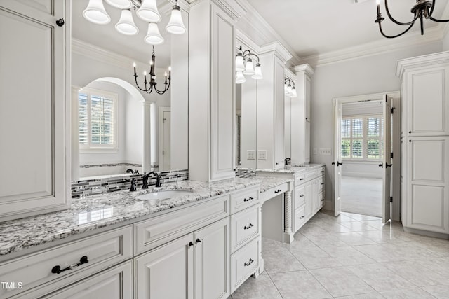 3908 Chaumont Dr, Apex, NC 27539 - bathroom with a chandelier, ornamental molding, vanity, and tile patterned flooring