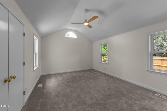 314 Wrenn St, Apex, NC 27502 - unfurnished bedroom with multiple windows, vaulted ceiling, carpet, baseboards, and ceiling fan