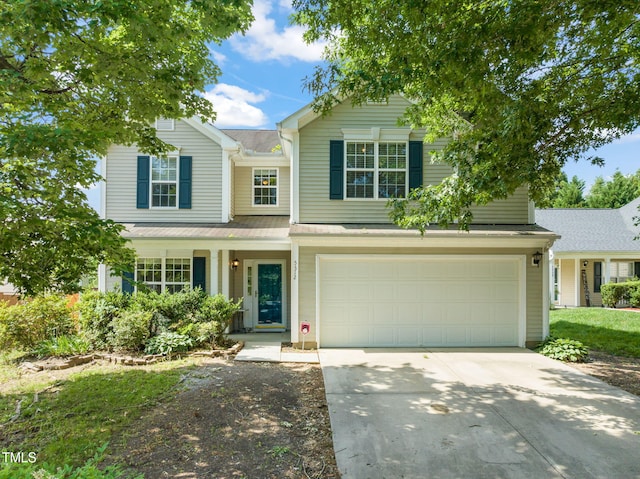 5312 Suntan Lake Dr, Raleigh, NC 27610 - traditional home with driveway, an attached garage, and a porch