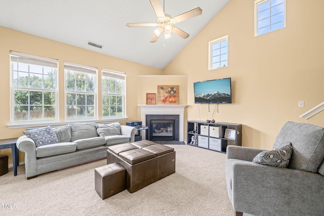 5312 Suntan Lake Dr, Raleigh, NC 27610 - living area with carpet floors, a ceiling fan, a fireplace with flush hearth, and high vaulted ceiling