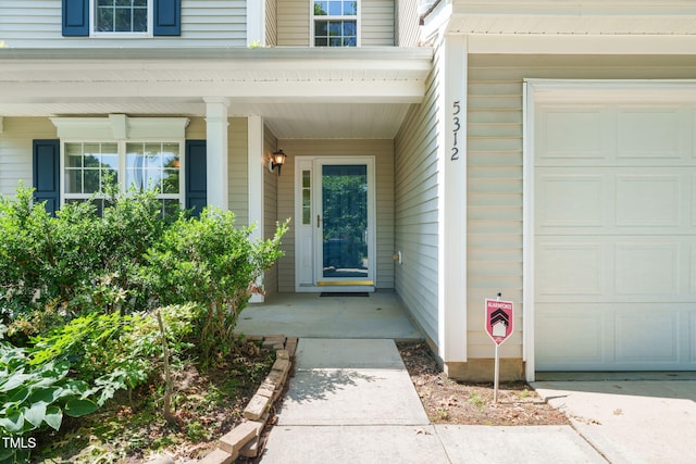 5312 Suntan Lake Dr, Raleigh, NC 27610 - property entrance featuring an attached garage and covered porch