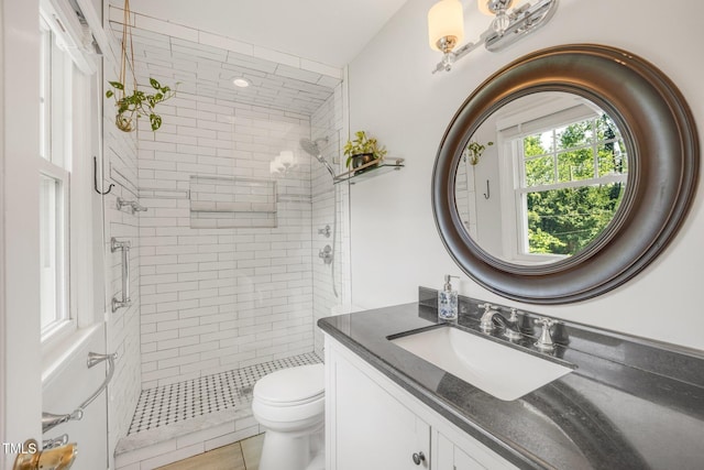 4021 Converse Dr, Raleigh, NC 27609 - full bath with a tile shower, vanity, and toilet