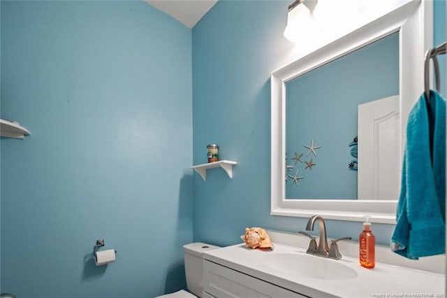 half bath with toilet and vanity