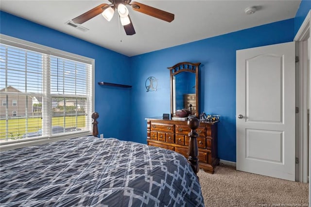 bedroom featuring carpet floors, a ceiling fan, and baseboards