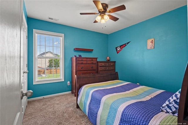 bedroom featuring carpet floors, baseboards, and ceiling fan
