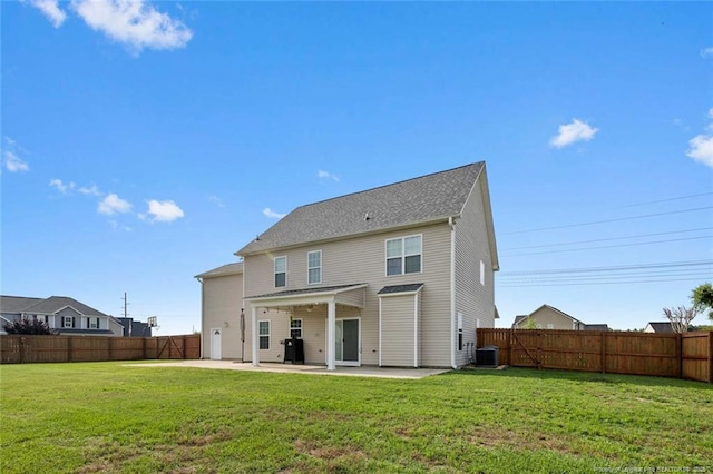 rear view of property with a patio and central AC