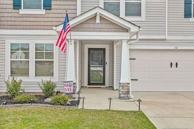 34 Merlin Ct, Godwin, NC 28344 - doorway to property featuring a garage and concrete driveway