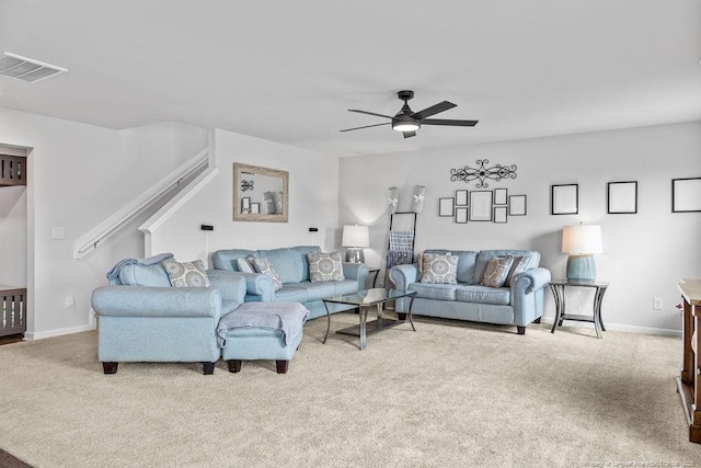 34 Merlin Ct, Godwin, NC 28344 - living area with carpet flooring, a ceiling fan, stairs, and baseboards