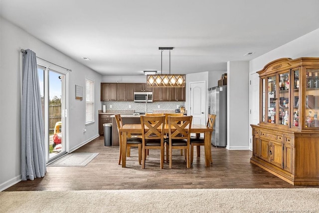 34 Merlin Ct, Godwin, NC 28344 - dining space with baseboards and dark wood-style flooring