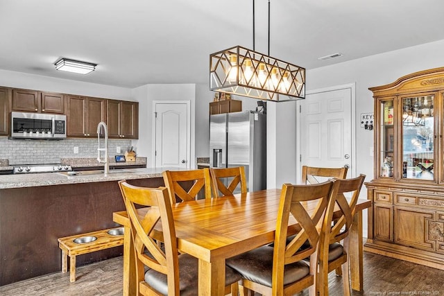 34 Merlin Ct, Godwin, NC 28344 - dining space featuring wood finished floors