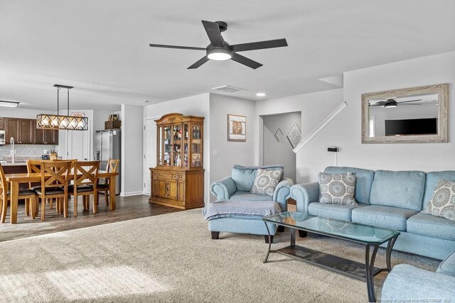 34 Merlin Ct, Godwin, NC 28344 - living room with a ceiling fan and dark carpet