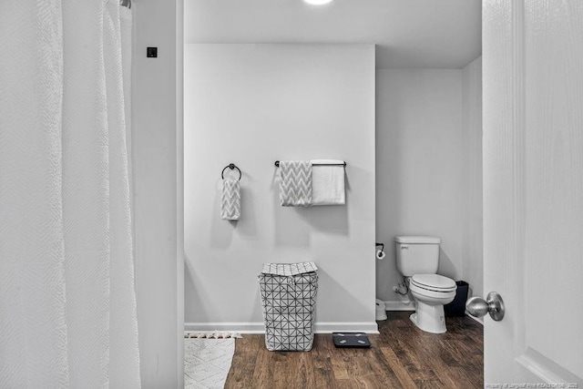 34 Merlin Ct, Godwin, NC 28344 - full bathroom featuring toilet, wood finished floors, a shower with shower curtain, and baseboards
