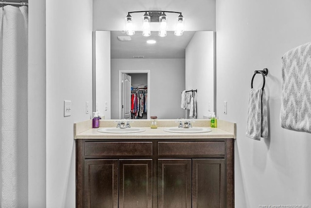 34 Merlin Ct, Godwin, NC 28344 - full bathroom featuring double vanity and a spacious closet