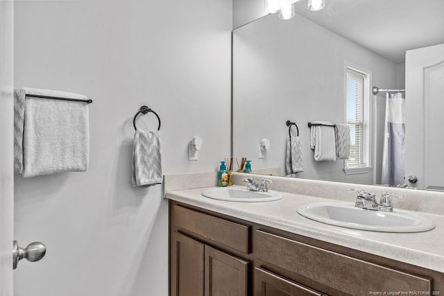 34 Merlin Ct, Godwin, NC 28344 - bathroom with double vanity and a shower with curtain