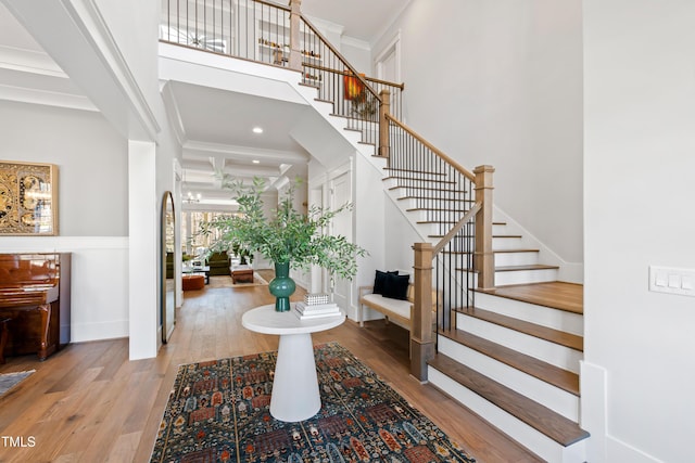 7212 Summer Tanager Trl, Raleigh, NC 27614 - foyer with stairs, wood finished floors, ornamental molding, recessed lighting, and a high ceiling