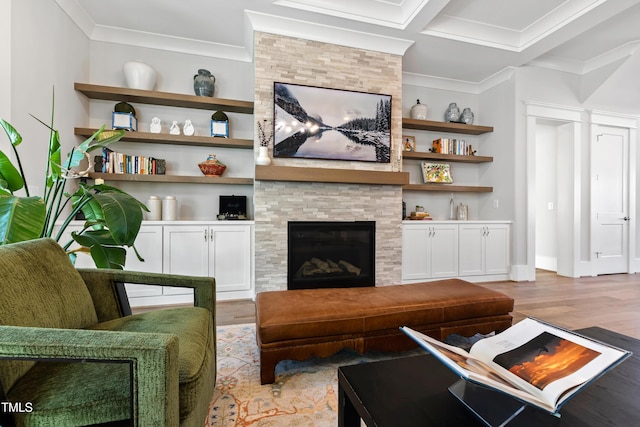 7212 Summer Tanager Trl, Raleigh, NC 27614 - living area featuring crown molding, wood finished floors, a fireplace, and built in features
