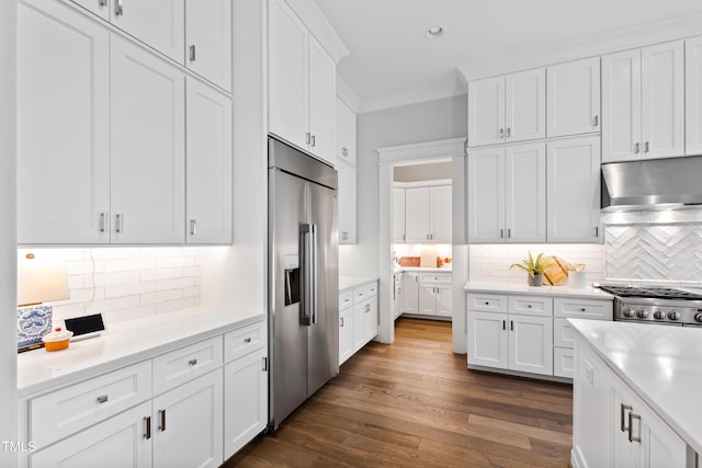 7212 Summer Tanager Trl, Raleigh, NC 27614 - kitchen with stainless steel built in fridge, under cabinet range hood, light countertops, decorative backsplash, and recessed lighting