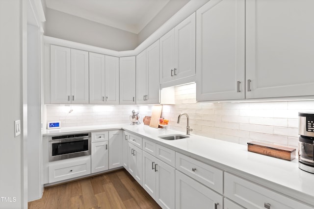 7212 Summer Tanager Trl, Raleigh, NC 27614 - kitchen with light countertops, white cabinetry, and decorative backsplash