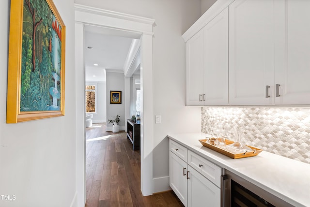 7212 Summer Tanager Trl, Raleigh, NC 27614 - indoor bar featuring backsplash, dark wood-type flooring, crown molding, beverage cooler, and recessed lighting