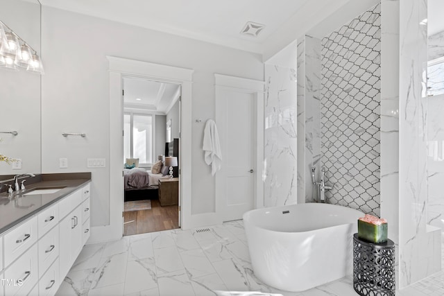 7212 Summer Tanager Trl, Raleigh, NC 27614 - bathroom featuring vanity, a freestanding bath, marble finish flooring, connected bathroom, and ornamental molding