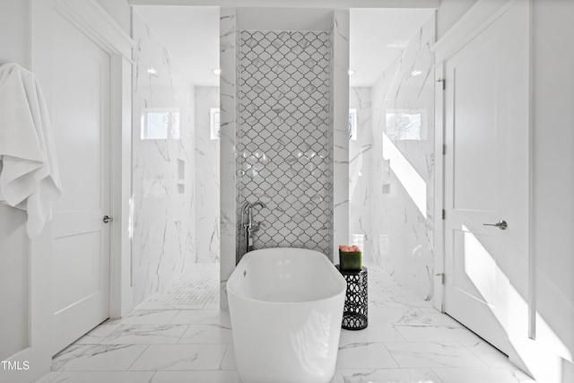 7212 Summer Tanager Trl, Raleigh, NC 27614 - full bathroom with marble finish flooring, a freestanding bath, and a marble finish shower
