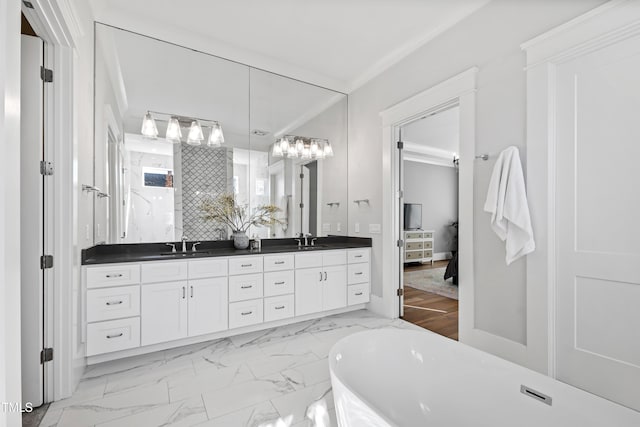 7212 Summer Tanager Trl, Raleigh, NC 27614 - full bath featuring double vanity, a soaking tub, marble look tile flooring, and tasteful backsplash