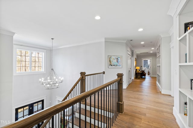 7212 Summer Tanager Trl, Raleigh, NC 27614 - hallway featuring a chandelier, an upstairs landing, light wood-style flooring, ornamental molding, and recessed lighting