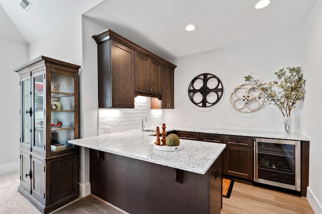7212 Summer Tanager Trl, Raleigh, NC 27614 - bar area with wine cooler, tasteful backsplash, recessed lighting, and light wood-style floors