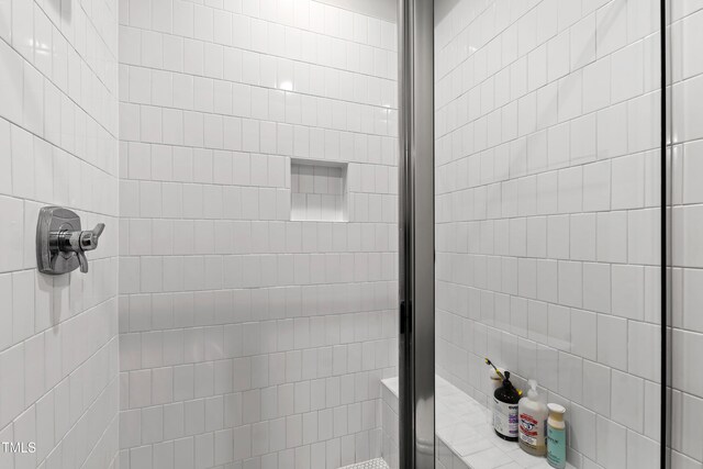 7212 Summer Tanager Trl, Raleigh, NC 27614 - bathroom featuring a tile shower