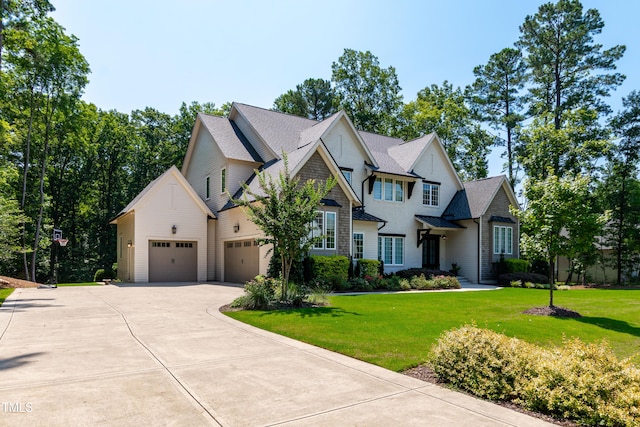 7212 Summer Tanager Trl, Raleigh, NC 27614 - craftsman-style house with driveway, a garage, a front yard, and a shingled roof