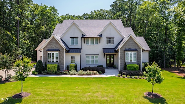 7212 Summer Tanager Trl, Raleigh, NC 27614 - view of front of home with a standing seam roof, a front yard, and roof with shingles