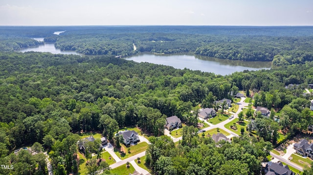 7212 Summer Tanager Trl, Raleigh, NC 27614 - aerial perspective of suburban area with a forest and a nearby body of water
