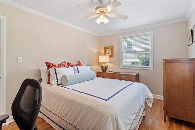 2913 Anderson Dr, Raleigh, NC 27608 - bedroom featuring wood finished floors, ornamental molding, baseboards, and ceiling fan