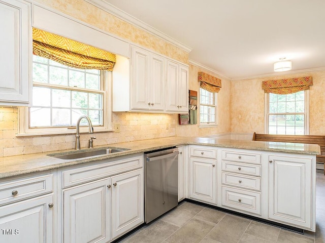 2228 Walker Ave, Burlington, NC 27215 - kitchen featuring dishwasher, a sink, a peninsula, ornamental molding, and backsplash