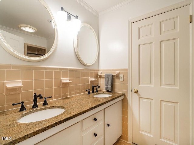 2228 Walker Ave, Burlington, NC 27215 - bathroom featuring tile walls, crown molding, double vanity, and wainscoting