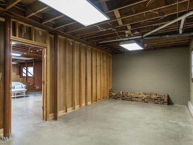 2228 Walker Ave, Burlington, NC 27215 - basement featuring brick wall