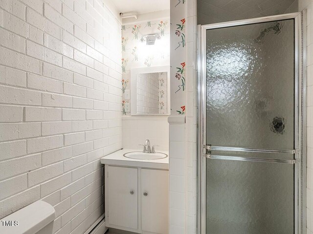 2228 Walker Ave, Burlington, NC 27215 - full bath featuring a stall shower, vanity, and toilet