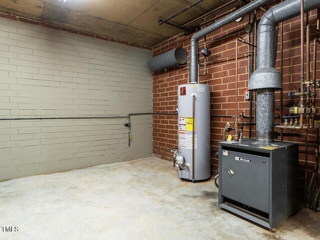 2228 Walker Ave, Burlington, NC 27215 - utility room featuring gas water heater and a heating unit