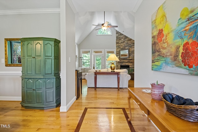 200 Daniel Ridge Ln, Roxboro, NC 27574 - foyer with a ceiling fan, light wood-style flooring, baseboards, a stone fireplace, and vaulted ceiling