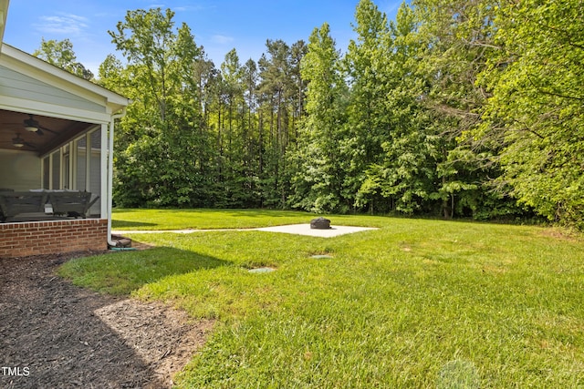 200 Daniel Ridge Ln, Roxboro, NC 27574 - view of grassy yard featuring an outdoor fire pit and ceiling fan