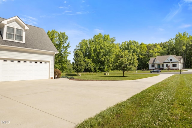 200 Daniel Ridge Ln, Roxboro, NC 27574 - view of green lawn with driveway and a garage