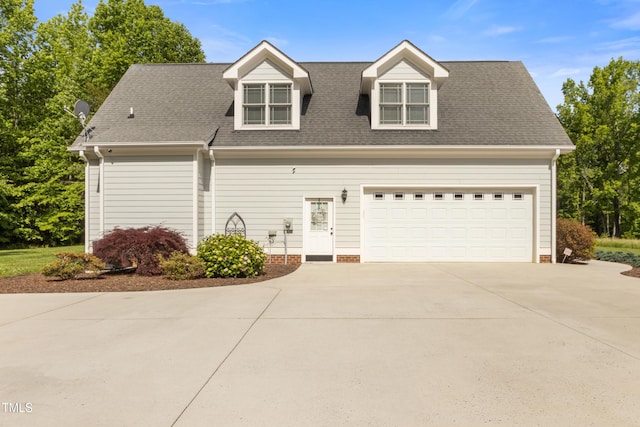 200 Daniel Ridge Ln, Roxboro, NC 27574 - new england style home featuring concrete driveway, roof with shingles, and an attached garage