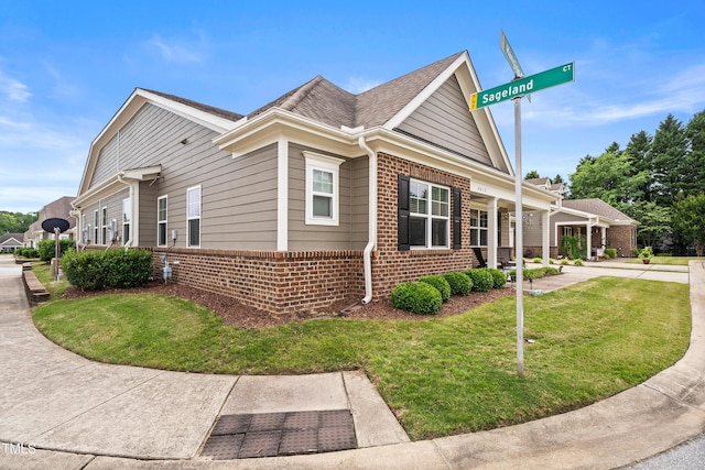 4612 Hanging Fern Ln, Raleigh, NC 27604 - view of side of home with brick siding and a lawn