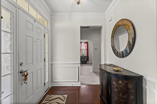 4612 Hanging Fern Ln, Raleigh, NC 27604 - entrance foyer featuring crown molding, dark wood finished floors, and a wainscoted wall